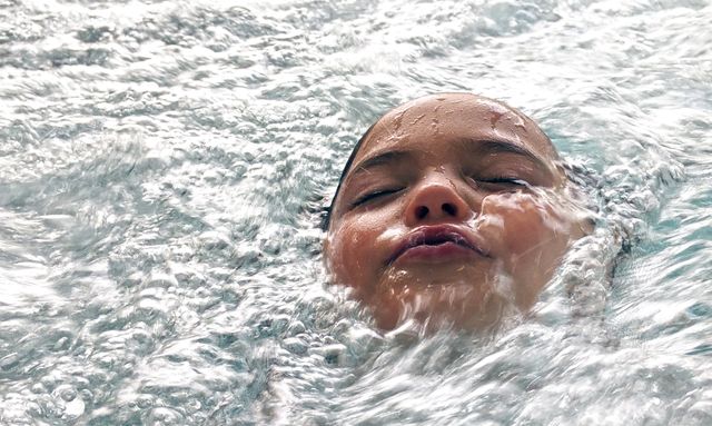 Child Enjoying Refreshing Swim with Face in Water - Download Free Stock Photos Pikwizard.com