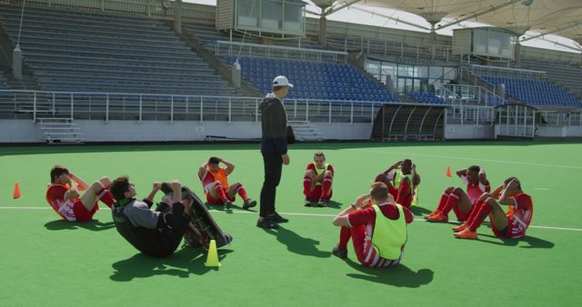 Soccer Team Training on Field with Coach Discussing Strategy - Download Free Stock Images Pikwizard.com