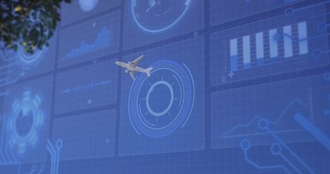 Airplane flying over futuristic digital muoverfuture monitoring panels