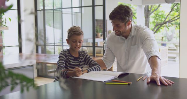 Father Assisting Son with Homework at Modern Home - Download Free Stock Images Pikwizard.com