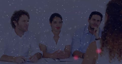 Diverse business team conducting interview with focused applicant