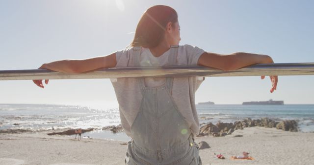 Woman Relaxing by the Beachside on a Sunny Day - Download Free Stock Images Pikwizard.com