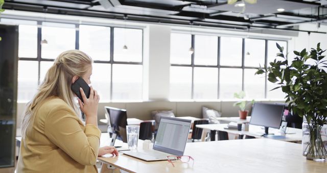 Businesswoman Working in Modern Office on Phone - Download Free Stock Images Pikwizard.com