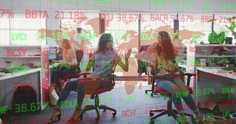 Diverse Businesswomen Analyzing Global Financial Data in Modern Office