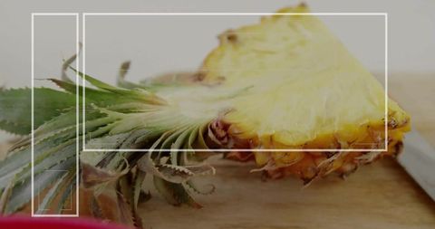 Fresh Cut Pineapple on Rustic Wooden Board in Kitchen Environment