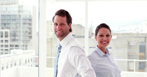 Confident Business Colleagues Smiling in Bright Office - Download Free Stock Images Pikwizard.com