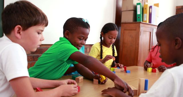 Pupils playing with building blocks in classroom in elementary school