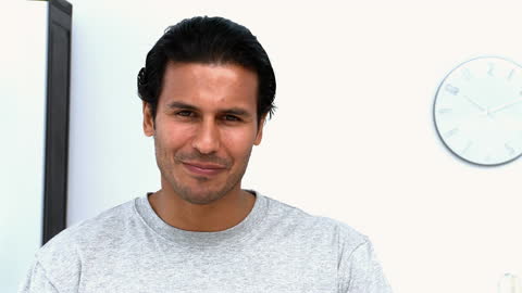 Smiling Man Enjoying Food Time in Modern Kitchen