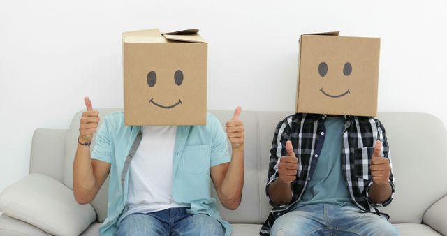 Friends Wearing Smiley Face Cardboard Boxes Giving Thumbs Up - Download Free Stock Images Pikwizard.com