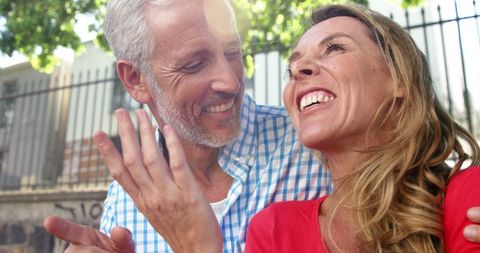 Mature Couple Sharing Joyful Moment Outdoors - Download Free Stock Images Pikwizard.com