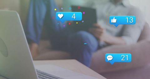 Man Relaxing on Sofa Engaging with Social Media on Tablet