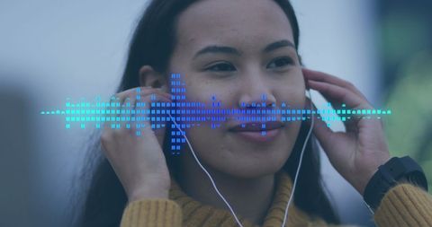 Woman engaging with digital sound interface visualization