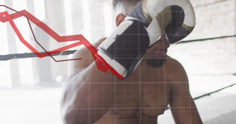 Shirtless boxer guarding face in ring with falling red graph overlay business decline metaphor