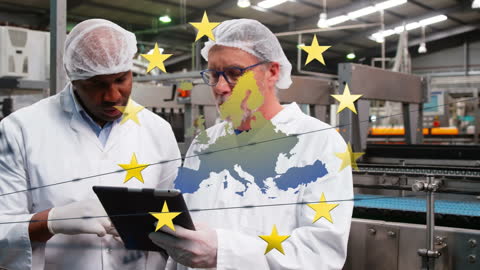 Engineers Reviewing Blueprints with EU Overlay in Modern Facility