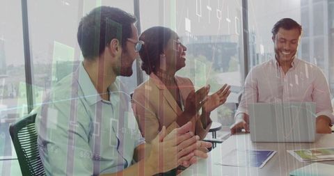 Corporate team applauding successful presentation