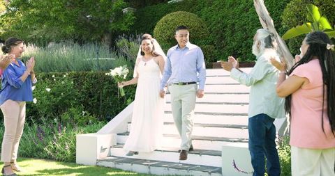 Joyful Senior Couple Celebrating Garden Wedding with Family