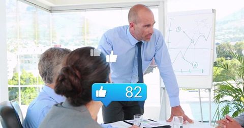 Business Leader Facilitating Discussion in Modern Office