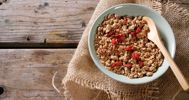 Bowl of Granola with Goji Berries on Rustic Wood Table - Download Free Stock Images Pikwizard.com