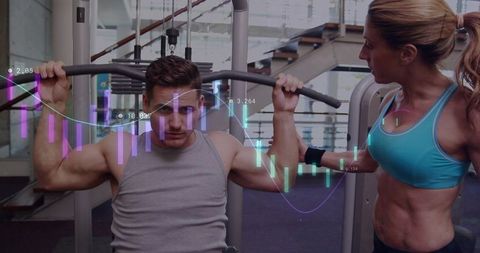 Female Trainer Guiding Male Athlete During Lat Pulldown With Fitness Data Overlay