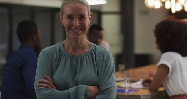 Confident Businesswoman Standing with Colleagues in Modern Office - Download Free Stock Images Pikwizard.com