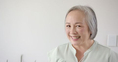 Cheerful Senior Woman Smiling Indoors