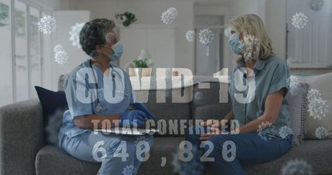 Doctor and Patient Discussing COVID-19 Pandemic Statistics