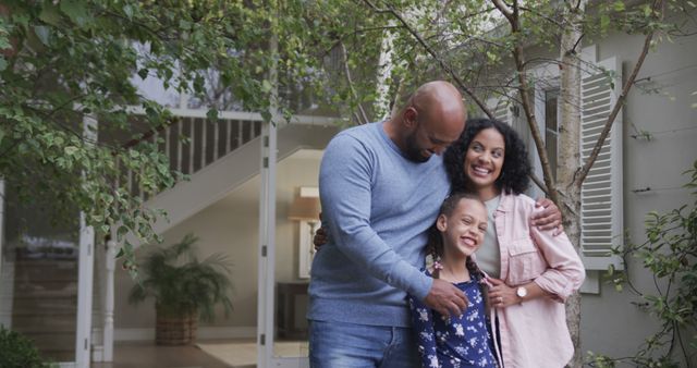 Happy Family Embracing in Front of Home - Download Free Stock Images Pikwizard.com