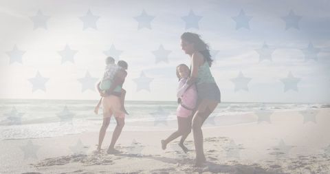 Biracial Family Enjoying Beachtime with American Flag Overlay