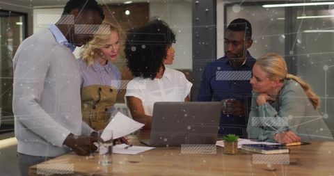 Diverse Team Collaborating in Modern Office with Network Graphics Overlay