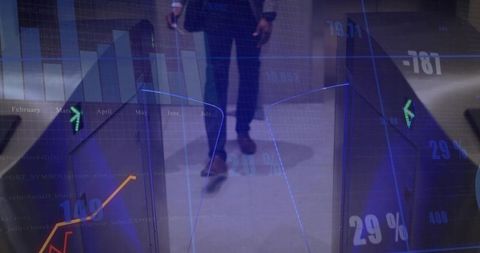 Businessman in corporate lobby with rising digital finance charts