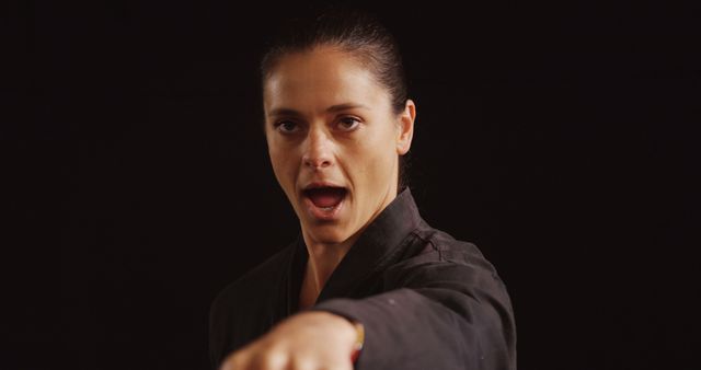 Female Martial Artist Practicing Karate Punch - Download Free Stock Images Pikwizard.com