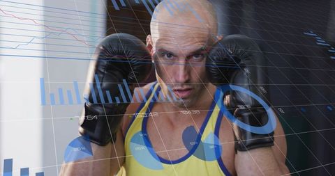 Focused boxer raising gloves with digital performance overlays, training intensity concept