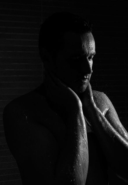 Contemplative Man Underwater in Shadows - Download Free Stock Photos Pikwizard.com