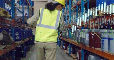 Warehouse worker in hi-vis gear with data visualization overlay
