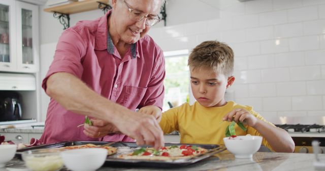 Grandfather Teaching Grandson to Make Pizza in Kitchen - Download Free Stock Images Pikwizard.com