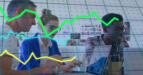 Collaborative team analyzing data on laptops with chart overlays, analytics workspace