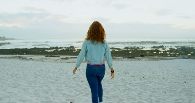 Woman Walking on a Sandy Beach at Sunset - Download Free Stock Images Pikwizard.com