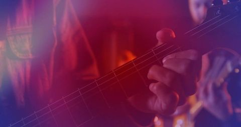 Guitarist on Stage Performing with Colorful Lighting