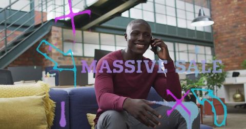 Happy Professional on Phone Call in Modern Office with Sale Overlay