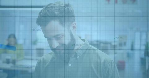 Bearded professional looking down in open-plan office with subtle analytics grid overlay