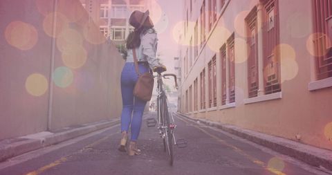 Urban Wanderer Walking with Bicycle in Colorful Lights - Download Free Stock Images Pikwizard.com