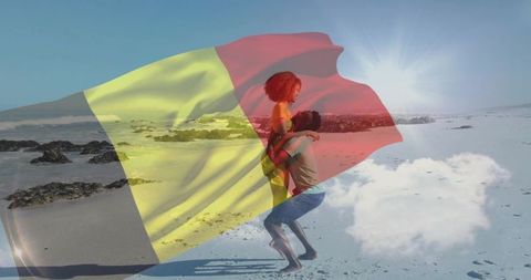 Playful couple lifting on sunlit beach with belgian flag double exposure overlay