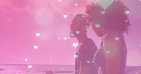 Couple Walking on Beach with Romantic Heart Overlay