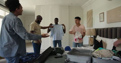 Friends packing in room for exciting group travel adventure