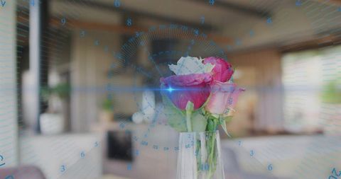 Clear glass vase holding pink roses with blue HUD overlay and lens flare in modern lounge