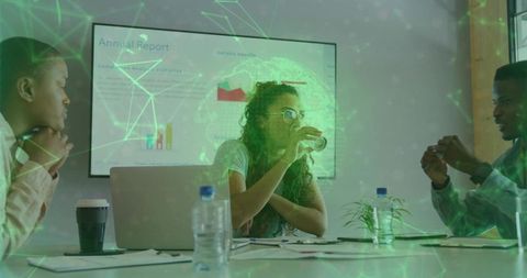 Professionals Collaborating in Modern Meeting with Digital Visualization