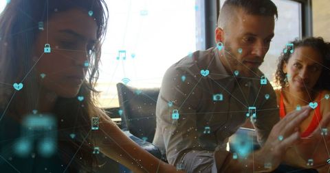 Team collaborating with digital interface holograms