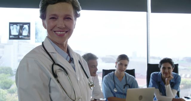 Confident Female Doctor Leading Medical Team Meeting in Hospital - Download Free Stock Images Pikwizard.com