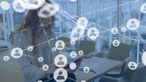 Networking Icons with Businesswoman Using Tablet in Office