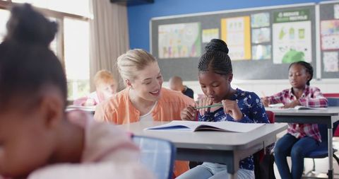 Teacher Guiding Student Through Academic Work